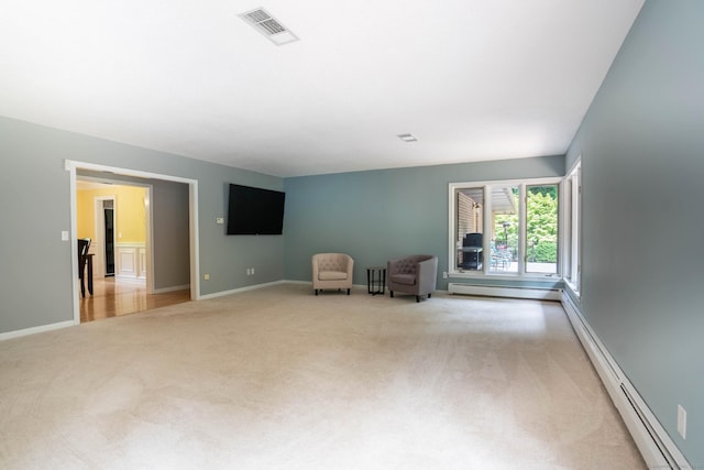 70R Tri Mountain Rd, Durham, CT 06422 - unfurnished room with light carpet, baseboard heating, baseboards, and a baseboard heating unit