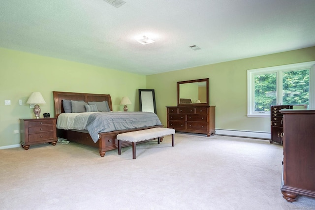 70R Tri Mountain Rd, Durham, CT 06422 - bedroom with a baseboard heating unit, carpet floors, baseboards, and a textured ceiling