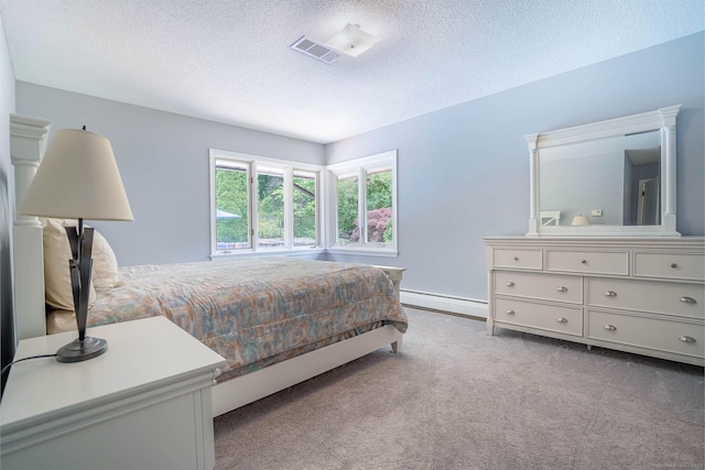 70R Tri Mountain Rd, Durham, CT 06422 - carpeted bedroom featuring a baseboard radiator and a textured ceiling