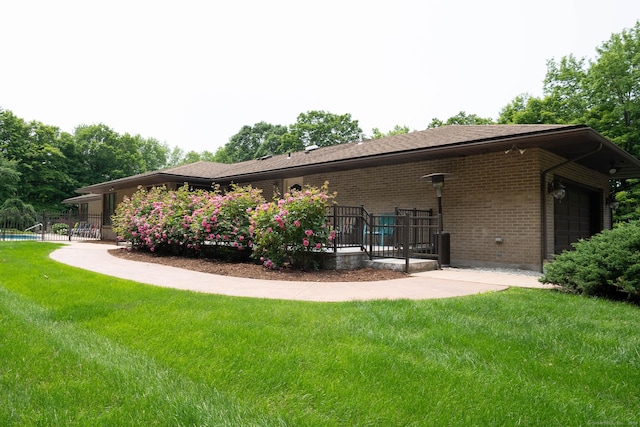 70R Tri Mountain Rd, Durham, CT 06422 - rear view of house with brick siding and an attached garage
