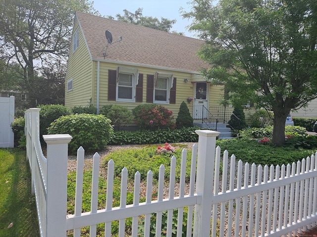 746 Hillside Ave, Hartford, CT 06106 - cape cod house featuring a fenced front yard and roof with shingles