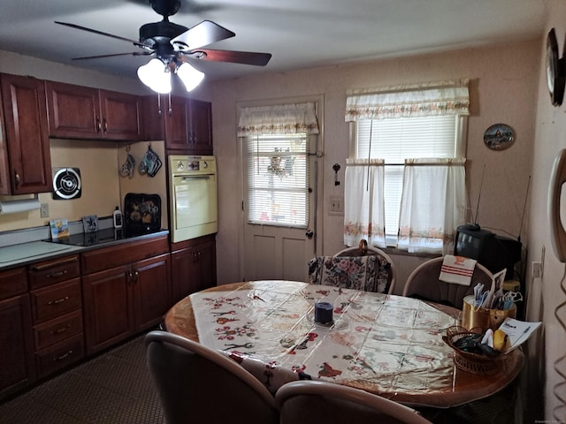 746 Hillside Ave, Hartford, CT 06106 - kitchen with wall oven, ceiling fan, and tile counters