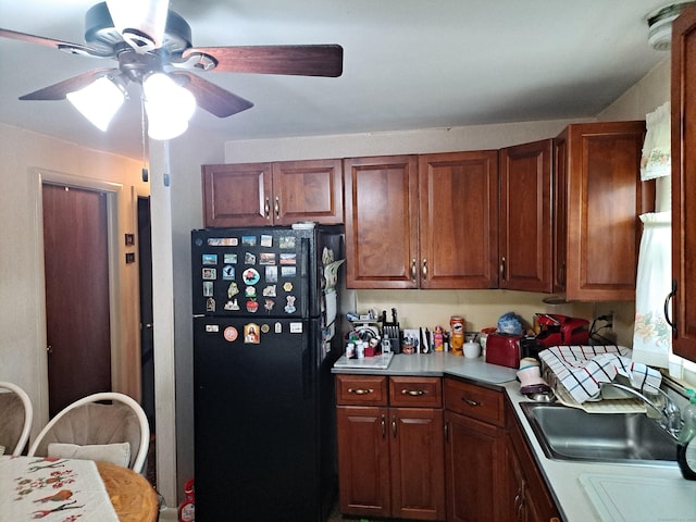 746 Hillside Ave, Hartford, CT 06106 - kitchen with freestanding refrigerator, a ceiling fan, light countertops, and a sink