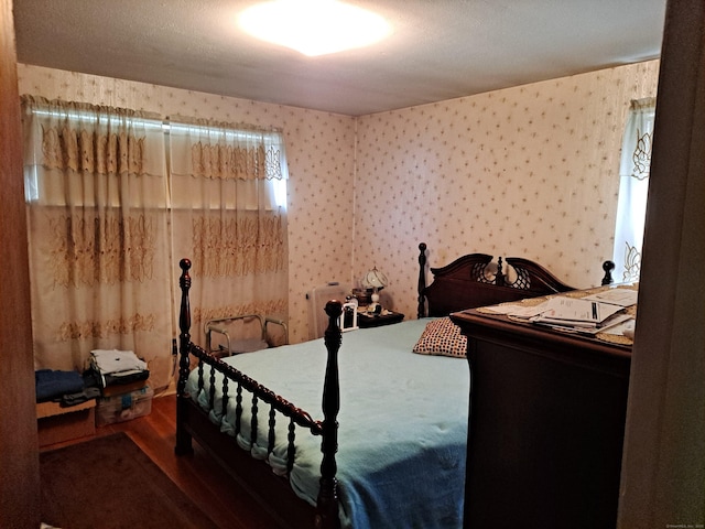 746 Hillside Ave, Hartford, CT 06106 - bedroom with wallpapered walls and wood finished floors