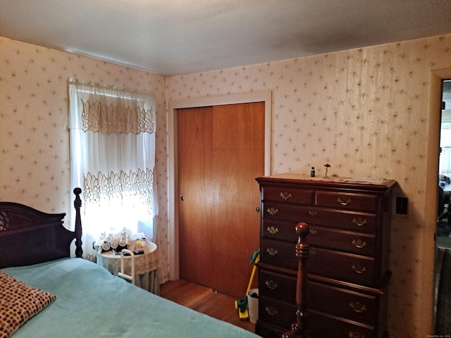 746 Hillside Ave, Hartford, CT 06106 - bedroom with wood finished floors, a closet, and wallpapered walls