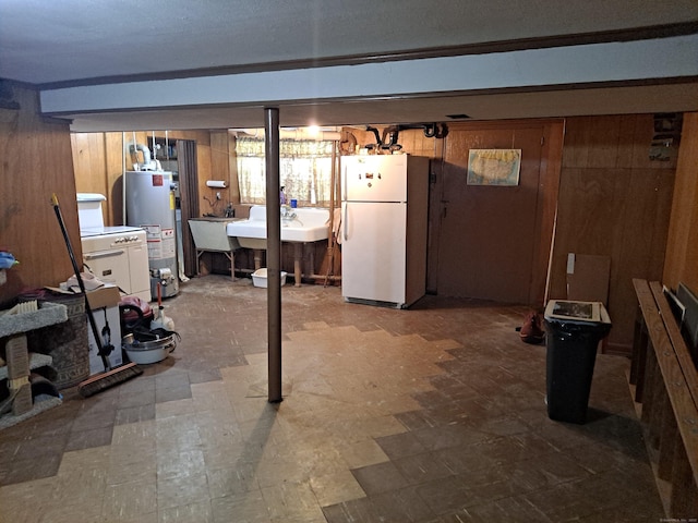 746 Hillside Ave, Hartford, CT 06106 - basement featuring freestanding refrigerator, gas water heater, a sink, tile patterned floors, and wooden walls