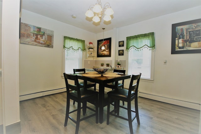 72 Brooker St, Torrington, CT 06790 - dining room featuring a baseboard radiator, a chandelier, and plenty of natural light