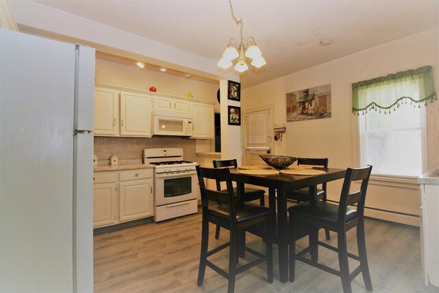 72 Brooker St, Torrington, CT 06790 - dining room featuring a chandelier, light wood-style flooring, and baseboard heating