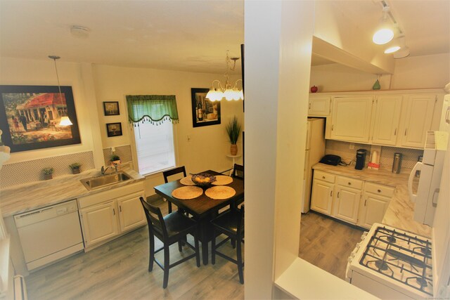 72 Brooker St, Torrington, CT 06790 - dining room with light wood-style flooring and a chandelier