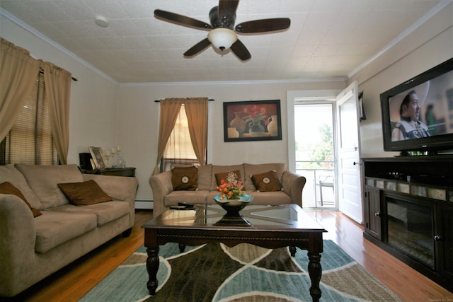 72 Brooker St, Torrington, CT 06790 - living area featuring crown molding, wood finished floors, a ceiling fan, and baseboard heating