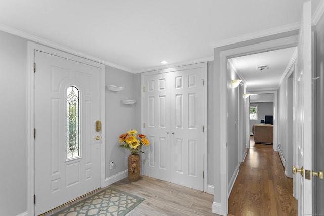 42 Woodledge Rd, Stamford, CT 06907 - entryway featuring wood finished floors, ornamental molding, and recessed lighting