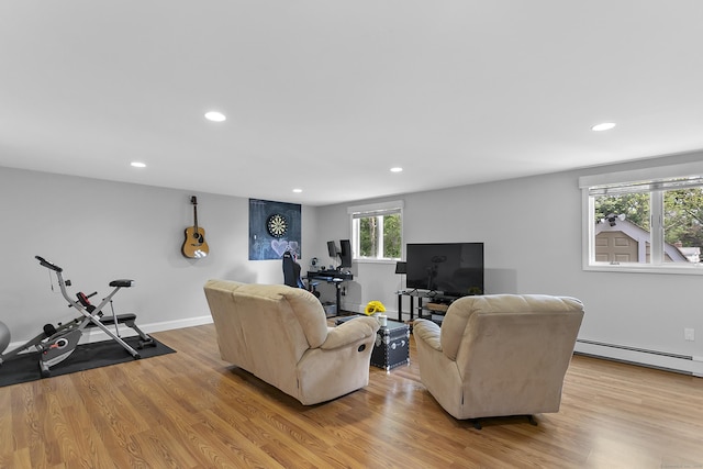 42 Woodledge Rd, Stamford, CT 06907 - living area with a baseboard radiator, light wood-type flooring, recessed lighting, and an office area