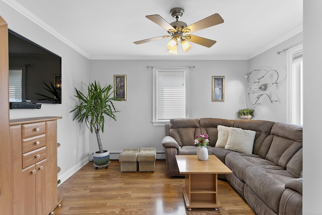 42 Woodledge Rd, Stamford, CT 06907 - living area featuring light wood finished floors, crown molding, a ceiling fan, and a baseboard heating unit