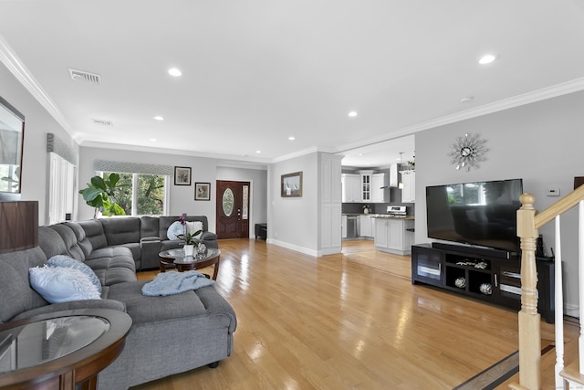 42 Woodledge Rd, Stamford, CT 06907 - living room with recessed lighting, ornamental molding, and light wood-style floors