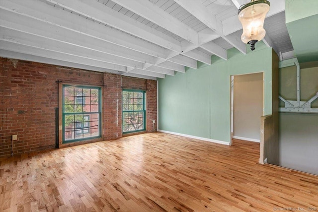 1 Front St Unit 204, New Haven, CT 06513 - unfurnished room with brick wall, wood finished floors, beam ceiling, and baseboards