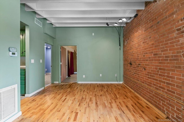 1 Front St Unit 204, New Haven, CT 06513 - spare room with brick wall, wood finished floors, beamed ceiling, and baseboards