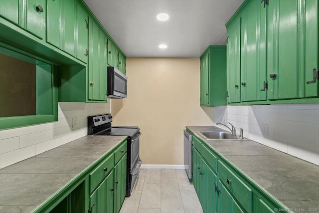 1 Front St Unit 204, New Haven, CT 06513 - kitchen featuring stainless steel appliances, green cabinetry, a sink, tasteful backsplash, and recessed lighting