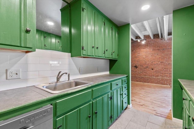1 Front St Unit 204, New Haven, CT 06513 - kitchen with brick wall, green cabinets, stainless steel dishwasher, a sink, and backsplash