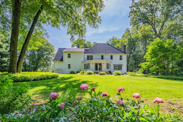 87 Falcon Crest Rd, Middlebury, CT 06762 - rear view of house featuring a chimney and a lawn