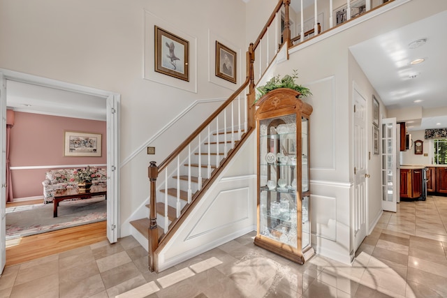 87 Falcon Crest Rd, Middlebury, CT 06762 - staircase with a decorative wall and tile patterned floors