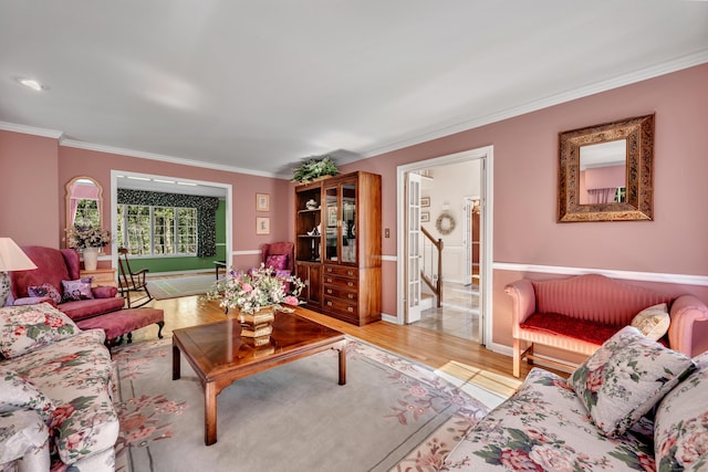 87 Falcon Crest Rd, Middlebury, CT 06762 - living room featuring ornamental molding, light wood finished floors, stairs, and wainscoting