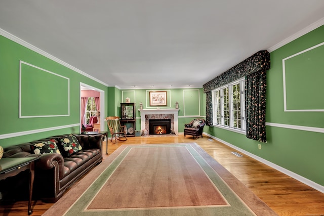 87 Falcon Crest Rd, Middlebury, CT 06762 - living room with wood finished floors, ornamental molding, and a fireplace