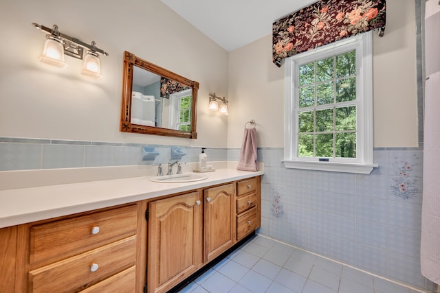 87 Falcon Crest Rd, Middlebury, CT 06762 - bathroom featuring tile walls, tile patterned flooring, vanity, and a wainscoted wall