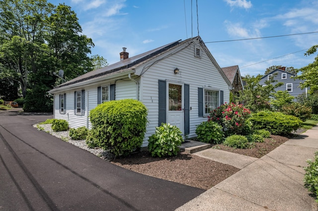 36 State St, Guilford, CT 06437 - view of front facade featuring a chimney