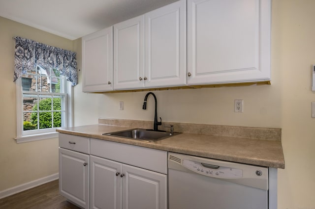 36 State St, Guilford, CT 06437 - kitchen with dishwasher, a sink, white cabinets, baseboards, and dark wood-type flooring