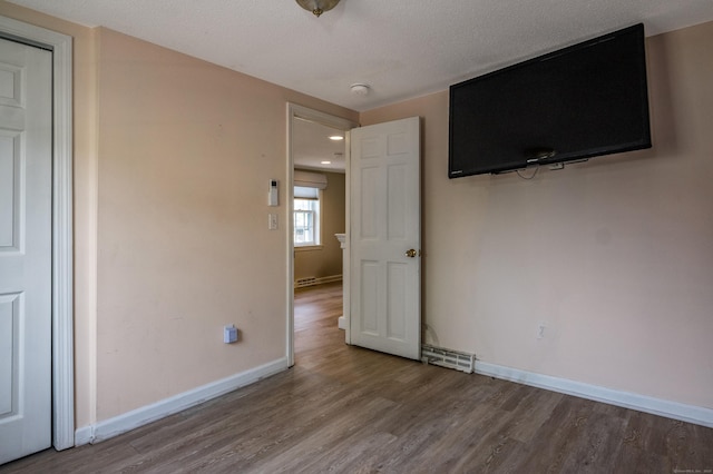 36 State St, Guilford, CT 06437 - unfurnished room featuring wood finished floors, baseboards, and a smoke detector