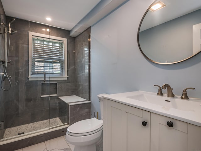 36 State St, Guilford, CT 06437 - bathroom featuring vanity, toilet, a shower stall, and marble look tile flooring