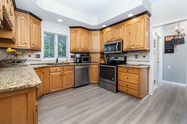 3580 Phelps Rd, Suffield, CT 06093 - kitchen featuring stainless steel appliances, a sink, light wood-style floors, light stone counters, and recessed lighting