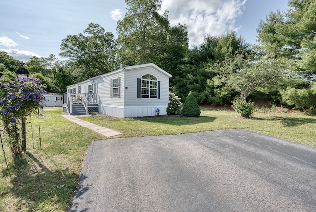107 Lions Way, Windham, CT 06256 - manufactured / mobile home featuring a front yard