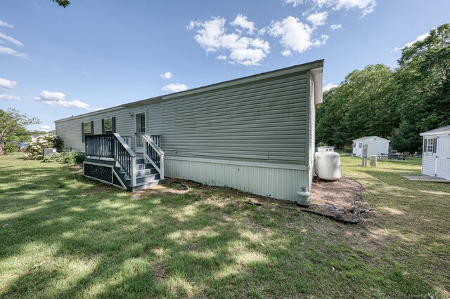 107 Lions Way, Windham, CT 06256 - rear view of property with a yard