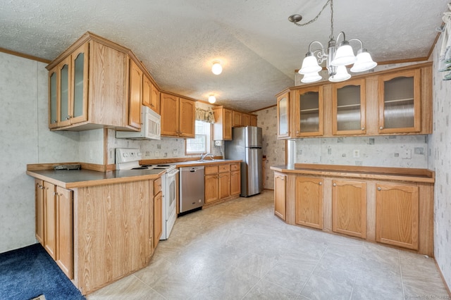 107 Lions Way, Windham, CT 06256 - kitchen featuring stainless steel appliances, a textured ceiling, a chandelier, crown molding, and a sink
