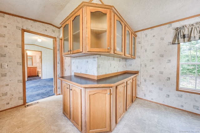 107 Lions Way, Windham, CT 06256 - kitchen featuring ornamental molding, a textured ceiling, wallpapered walls, baseboards, and glass insert cabinets