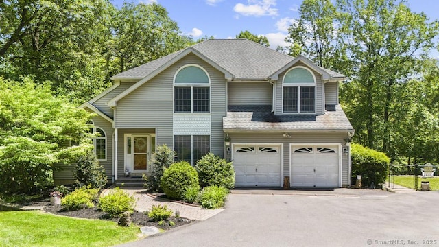 17 Raven Crest Dr, Bethel, CT 06801 - traditional home with driveway, an attached garage, and roof with shingles