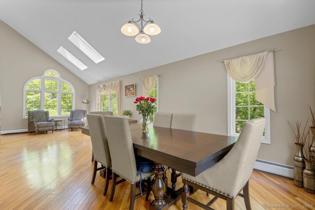 17 Raven Crest Dr, Bethel, CT 06801 - dining space featuring a baseboard radiator, light wood-style floors, a skylight, a chandelier, and baseboard heating