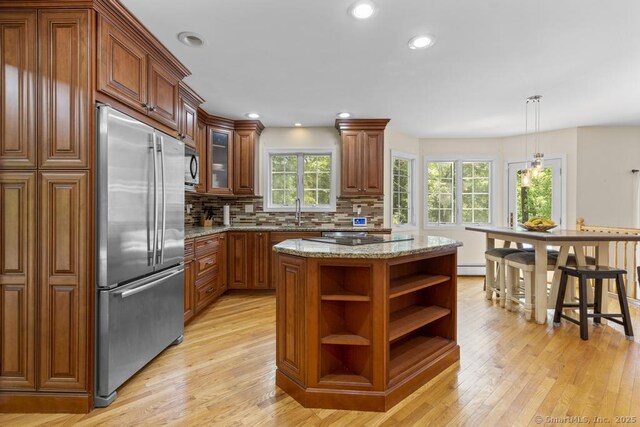 17 Raven Crest Dr, Bethel, CT 06801 - kitchen with black appliances, open shelves, light wood-style flooring, a sink, and decorative backsplash