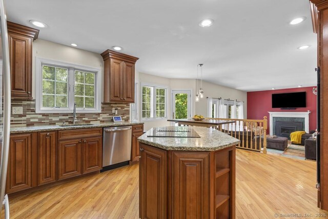 17 Raven Crest Dr, Bethel, CT 06801 - kitchen featuring dishwasher, a sink, light wood-type flooring, a kitchen island, and a fireplace