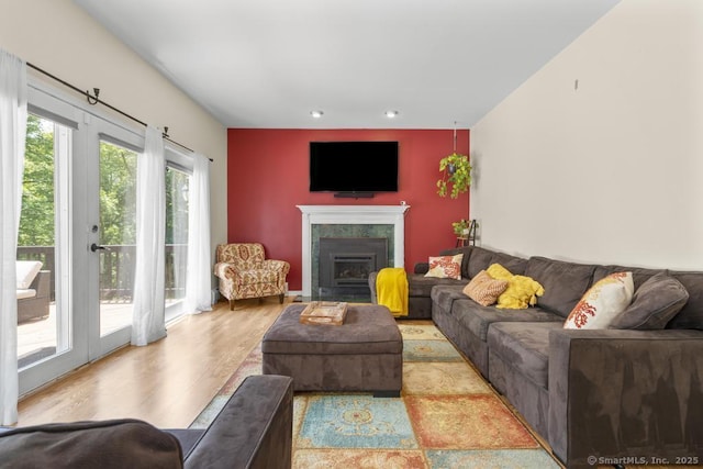 17 Raven Crest Dr, Bethel, CT 06801 - living area with a fireplace with flush hearth, wood finished floors, and recessed lighting