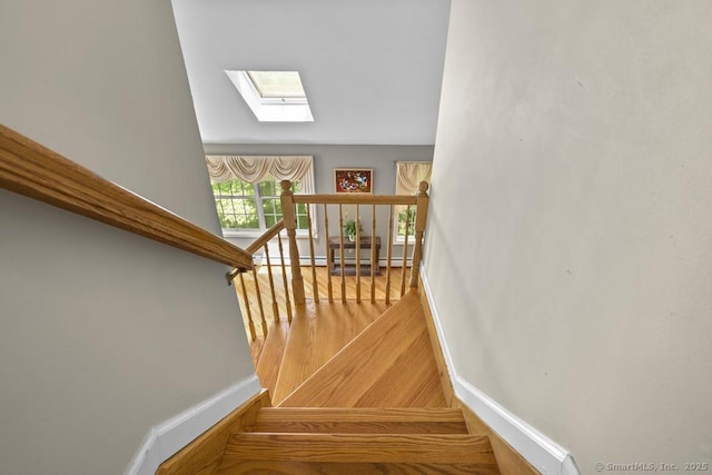 17 Raven Crest Dr, Bethel, CT 06801 - staircase with a skylight, baseboards, wood finished floors, and baseboard heating