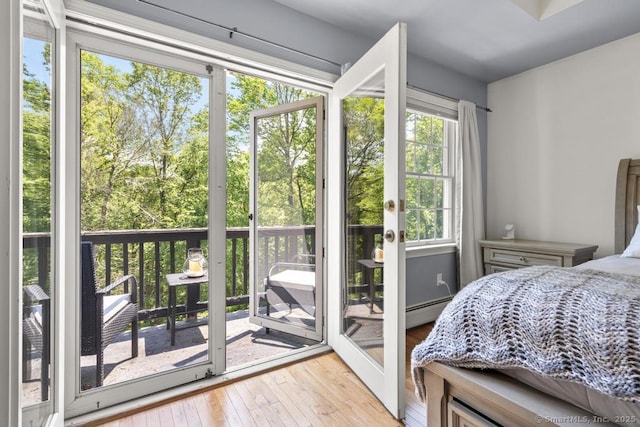 17 Raven Crest Dr, Bethel, CT 06801 - bedroom with hardwood / wood-style floors, baseboard heating, and access to exterior