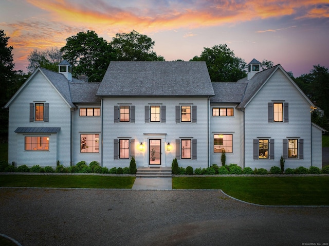 300 Hollow Tree Ridge Rd, Darien, CT 06820 - shingle-style home with a shingled roof, a chimney, and a front yard