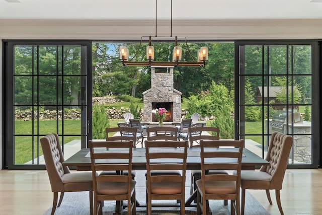 300 Hollow Tree Ridge Rd, Darien, CT 06820 - dining area with a chandelier, plenty of natural light, and wood finished floors
