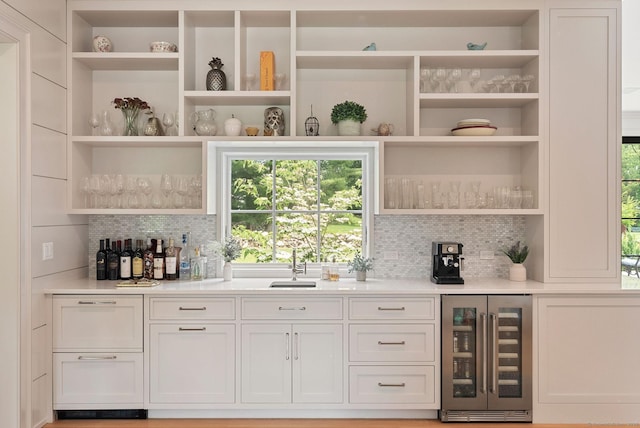 300 Hollow Tree Ridge Rd, Darien, CT 06820 - indoor dry bar with wine cooler and decorative backsplash