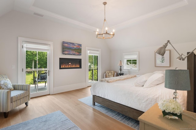 300 Hollow Tree Ridge Rd, Darien, CT 06820 - bedroom with a tray ceiling, a chandelier, multiple windows, access to outside, and vaulted ceiling