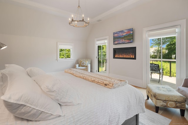 300 Hollow Tree Ridge Rd, Darien, CT 06820 - bedroom featuring access to outside, multiple windows, a chandelier, and vaulted ceiling