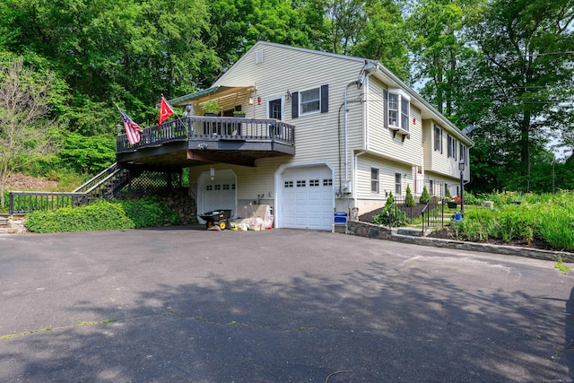 34 Cedar Rock Rd, Woodbridge, CT 06525 - view of home's exterior with an attached garage, stairs, a deck, and asphalt driveway