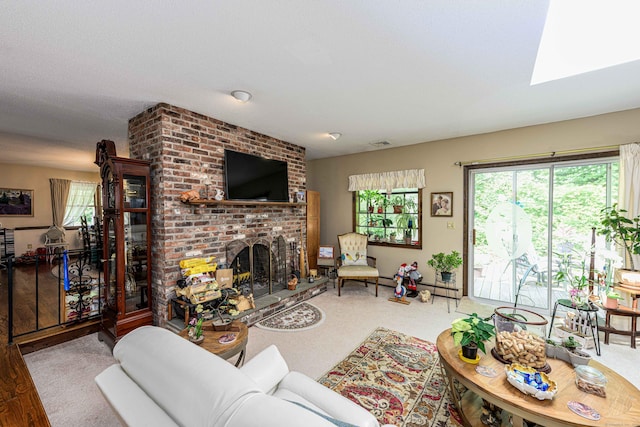 34 Cedar Rock Rd, Woodbridge, CT 06525 - living area featuring a brick fireplace, a skylight, and carpet flooring